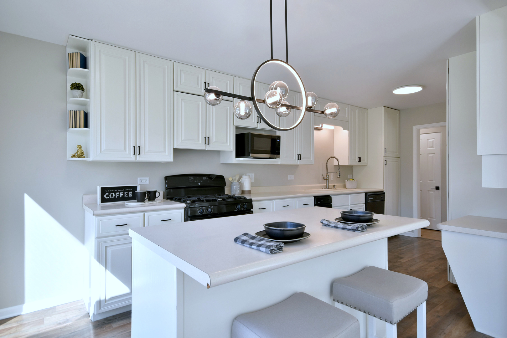 646 Spring Road Elmhurst, IL 60126 - Photo 3 of 17 a kitchen with a stove a table and chairs