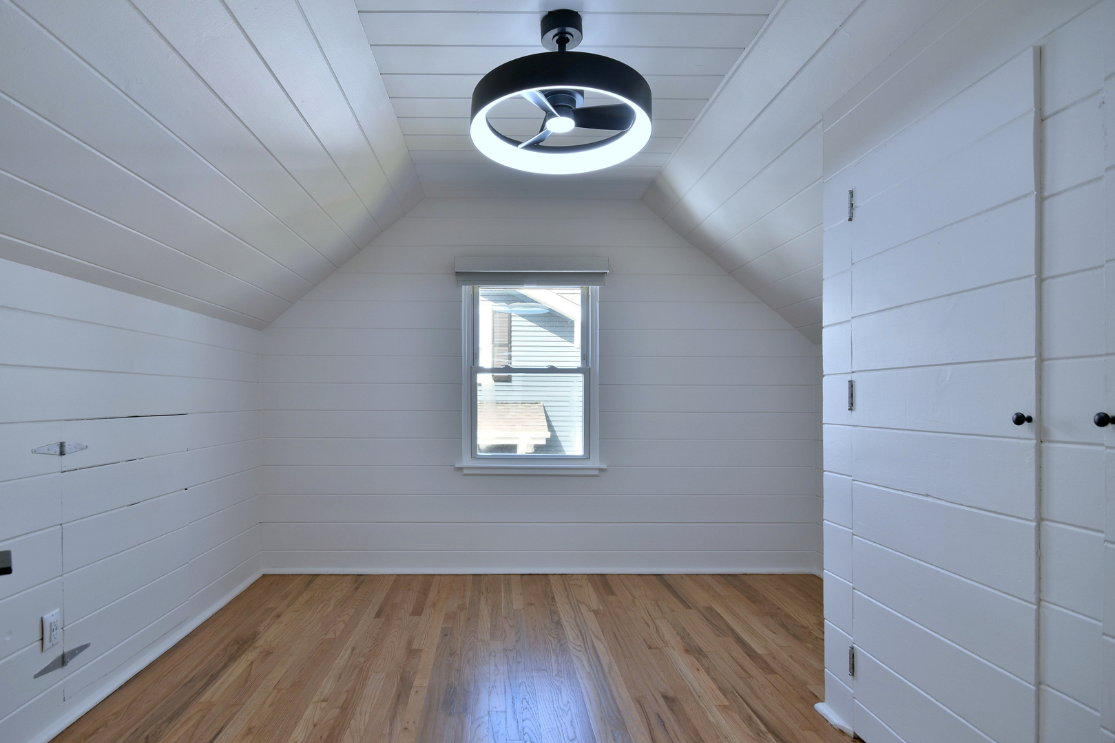646 Spring Road Elmhurst, IL 60126 - Photo 8 of 17 a view of an empty room with wooden floor and a window