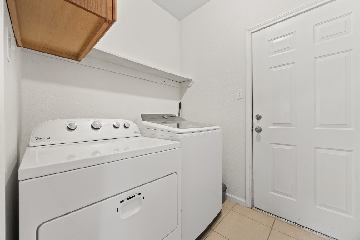 803 North Myrtle Street Georgetown, TX 78626 - Photo 16 of 40 Laundry room with independent washer and dryer and light tile patterned flooring