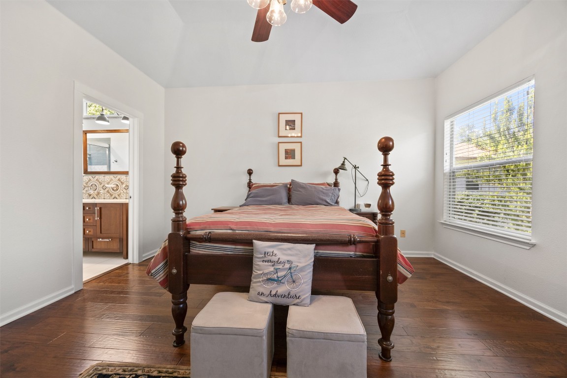 803 North Myrtle Street Georgetown, TX 78626 - Photo 18 of 40 Bedroom featuring hardwood / wood-style flooring, connected bathroom, and ceiling fan
