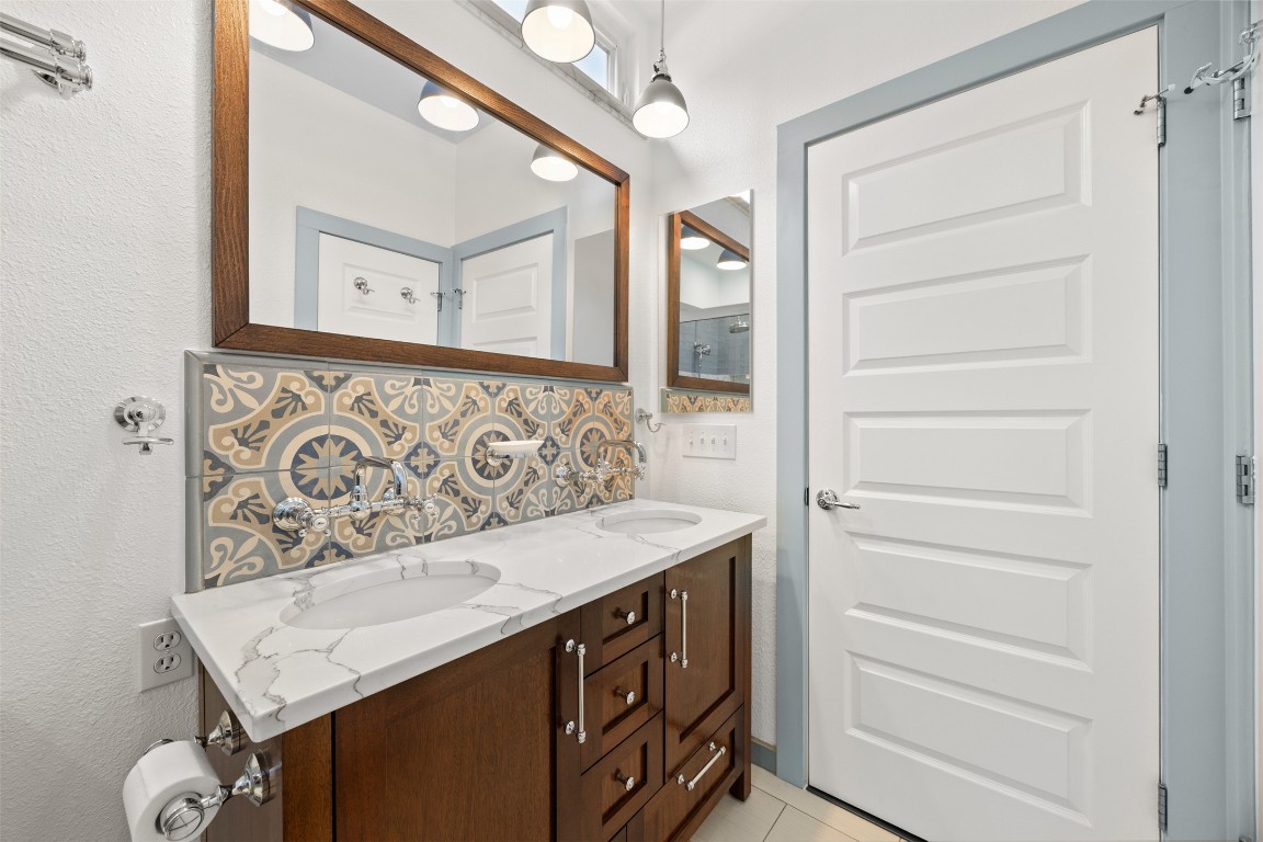 803 North Myrtle Street Georgetown, TX 78626 - Photo 20 of 40 Full bath featuring double vanity, tasteful backsplash, and tile patterned floors