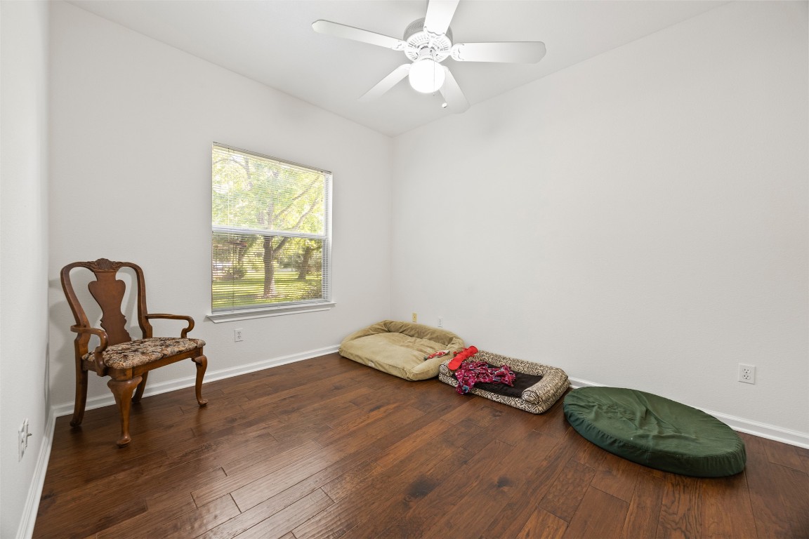 803 North Myrtle Street Georgetown, TX 78626 - Photo 24 of 40 Living area with hardwood / wood-style flooring and a ceiling fan