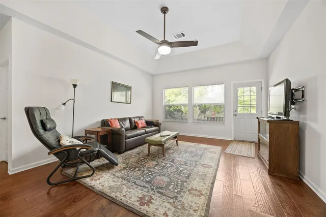 a living room with furniture and a rug
