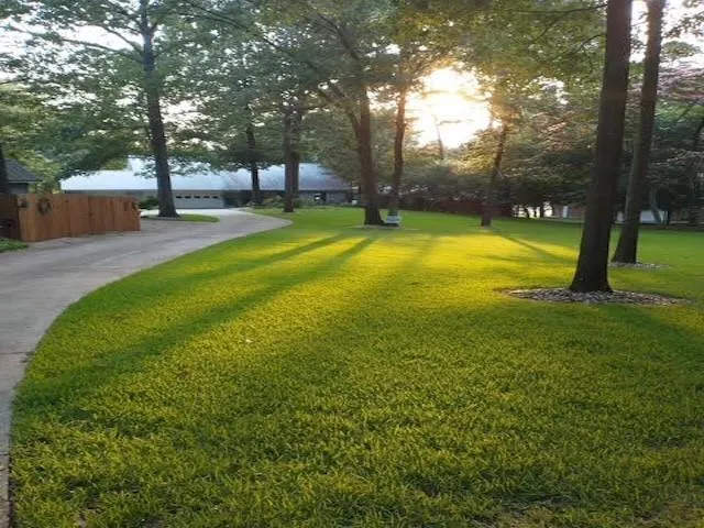 a swimming pool with outdoor seating and yard