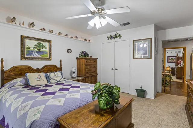 a bed room with a bed and a chandelier