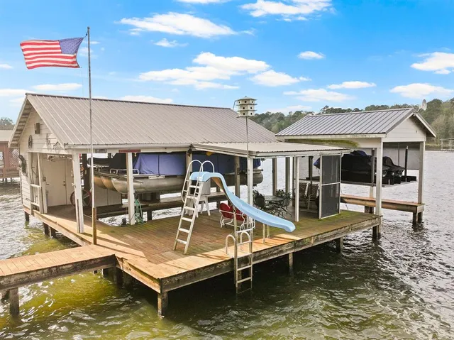 a view of a house with swimming pool and porch