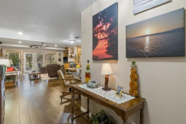 a view of a workspace with furniture and wooden floor