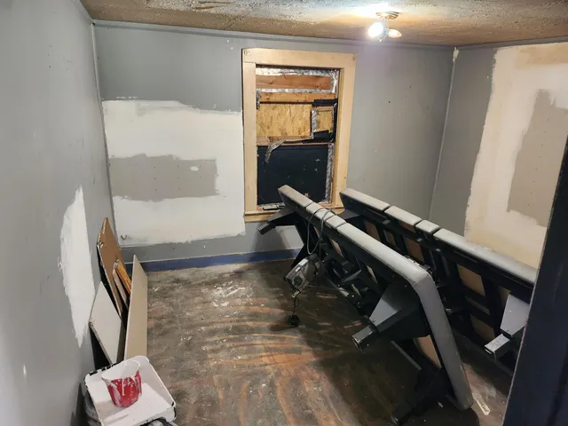 a room with wooden floor and furniture