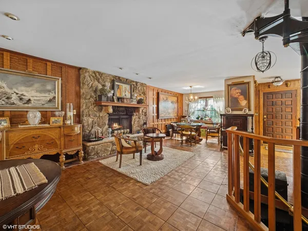 a living room with furniture a rug and a window