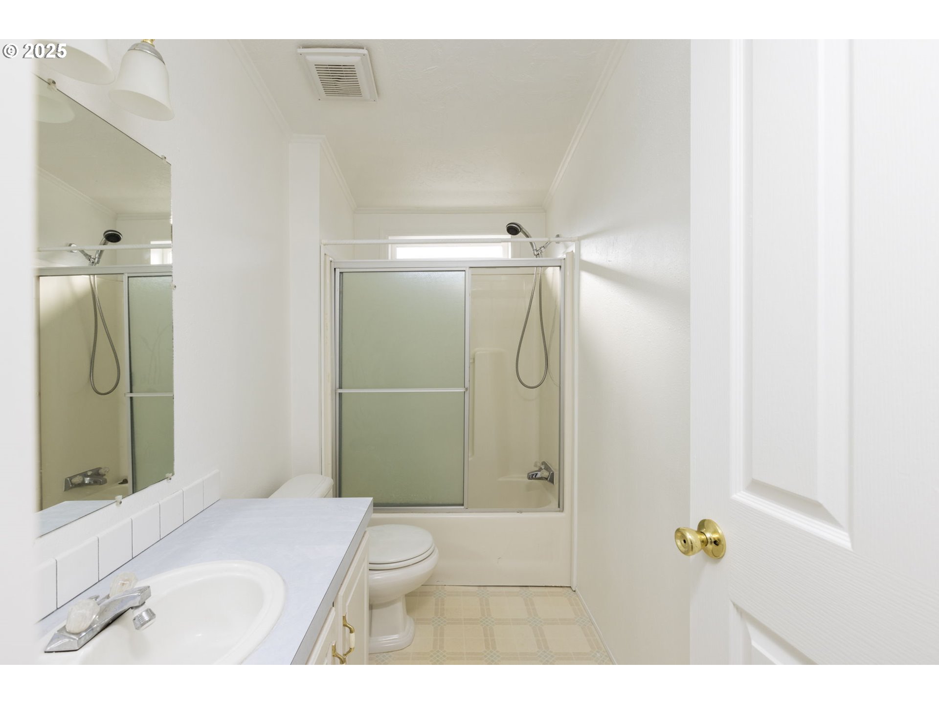 1949 Southeast Palmquist Road, Unit 80 Gresham, OR 97080 - Photo 27 of 35 a bathroom with a granite countertop sink a toilet and shower
