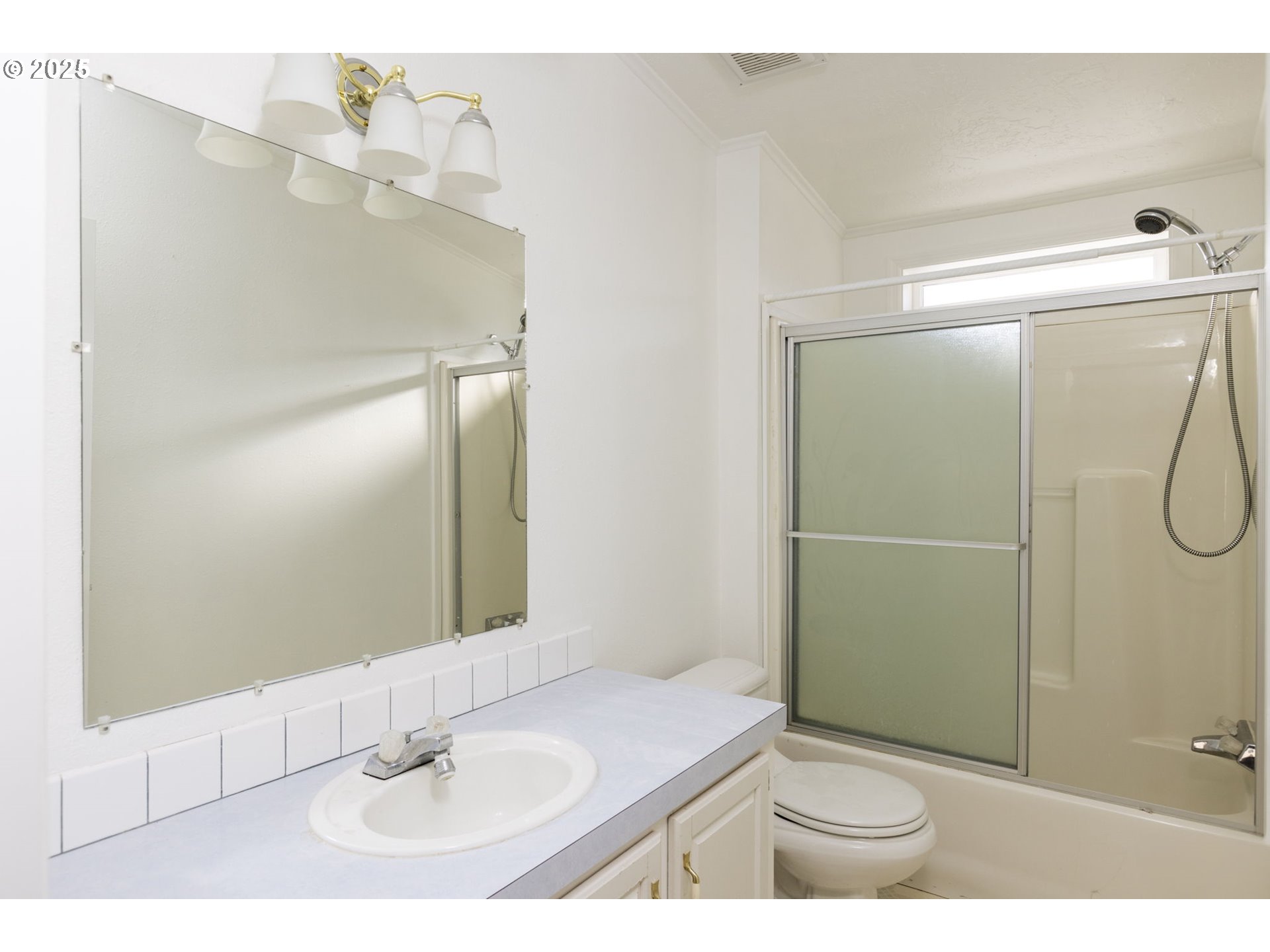 1949 Southeast Palmquist Road, Unit 80 Gresham, OR 97080 - Photo 28 of 35 a bathroom with a sink a toilet and shower