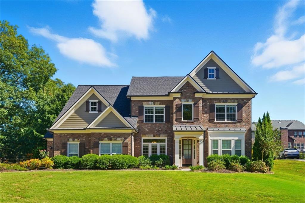 12115 Spence Way Alpharetta, GA 30004 - Photo 1 of 46 a front view of a house with a yard