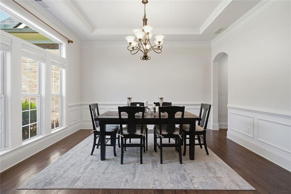 12115 Spence Way Alpharetta, GA 30004 - Photo 11 of 46 a view of a dining room with furniture window and wooden floor