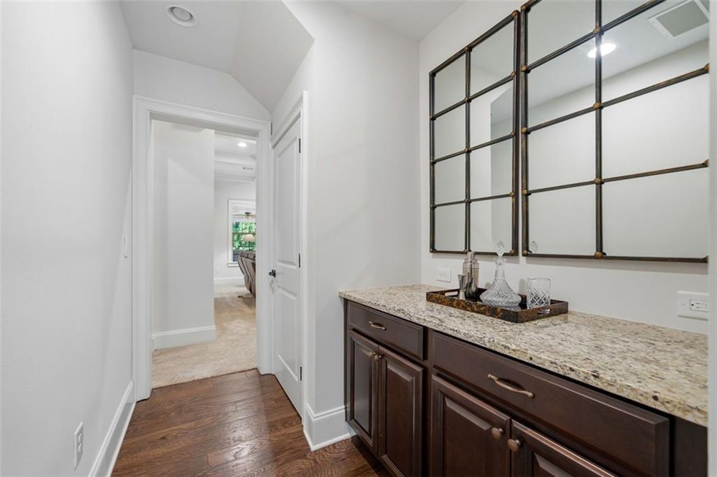 12115 Spence Way Alpharetta, GA 30004 - Photo 13 of 46 a bathroom with a granite countertop sink and a mirror