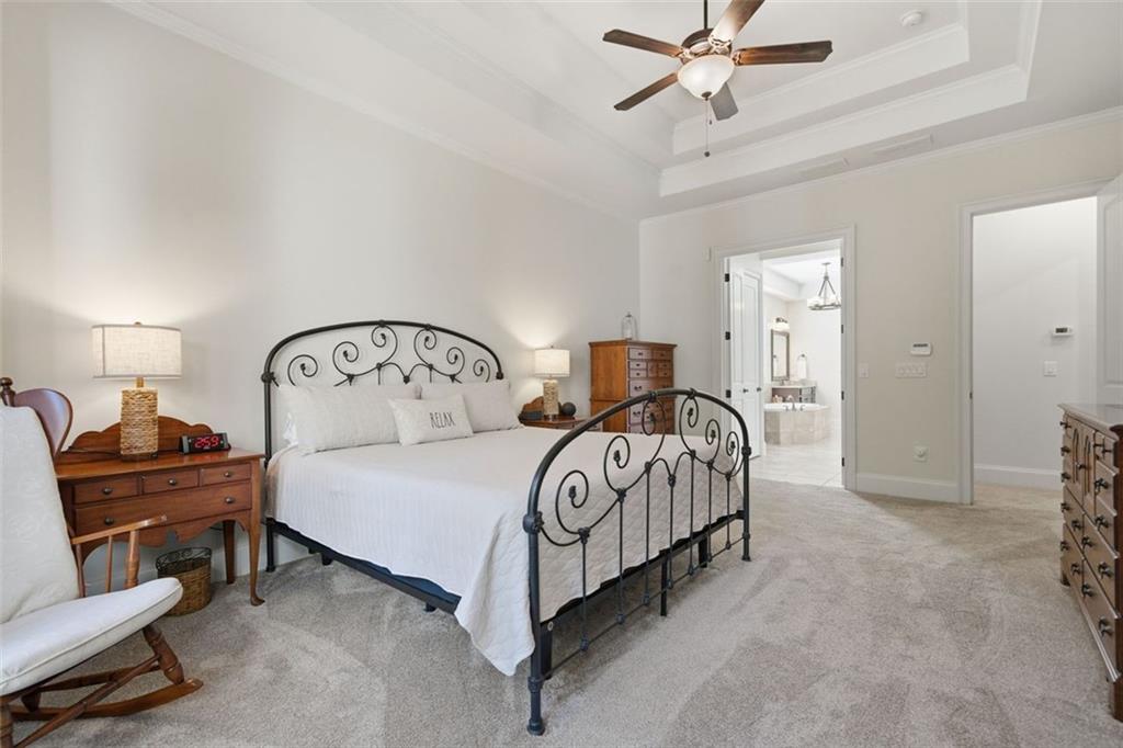 12115 Spence Way Alpharetta, GA 30004 - Photo 19 of 46 a bedroom with a bed and a chandelier