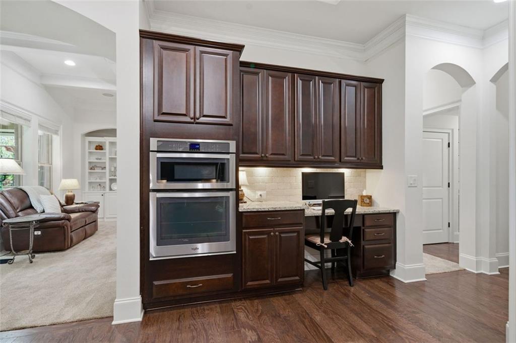 12115 Spence Way Alpharetta, GA 30004 - Photo 26 of 46 a kitchen with granite countertop wooden cabinets and appliances
