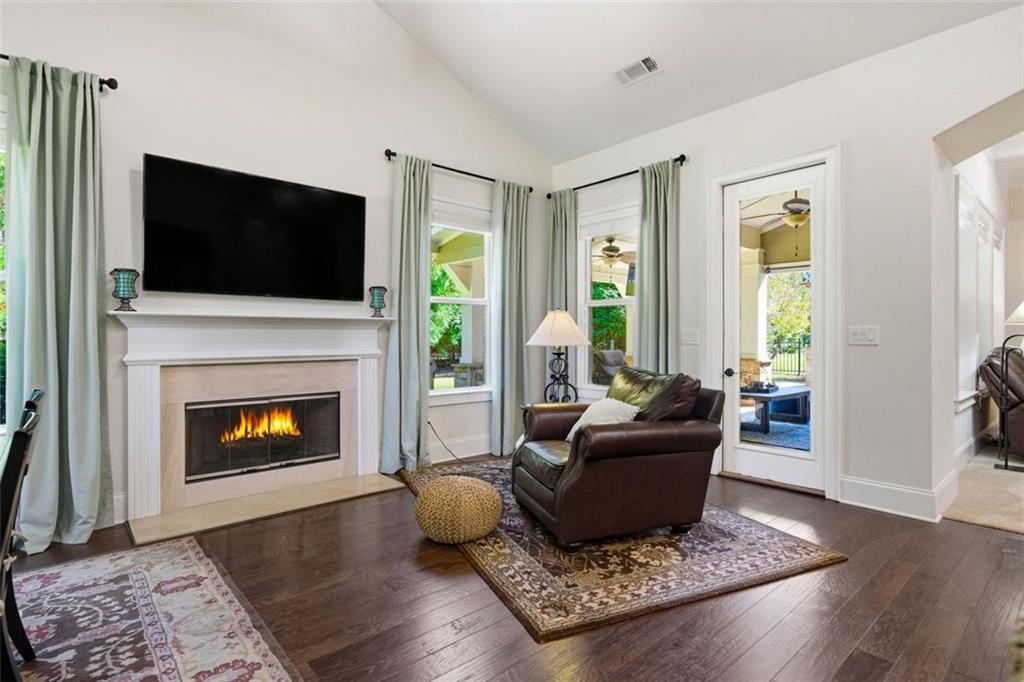 12115 Spence Way Alpharetta, GA 30004 - Photo 29 of 46 a living room with furniture and a fireplace