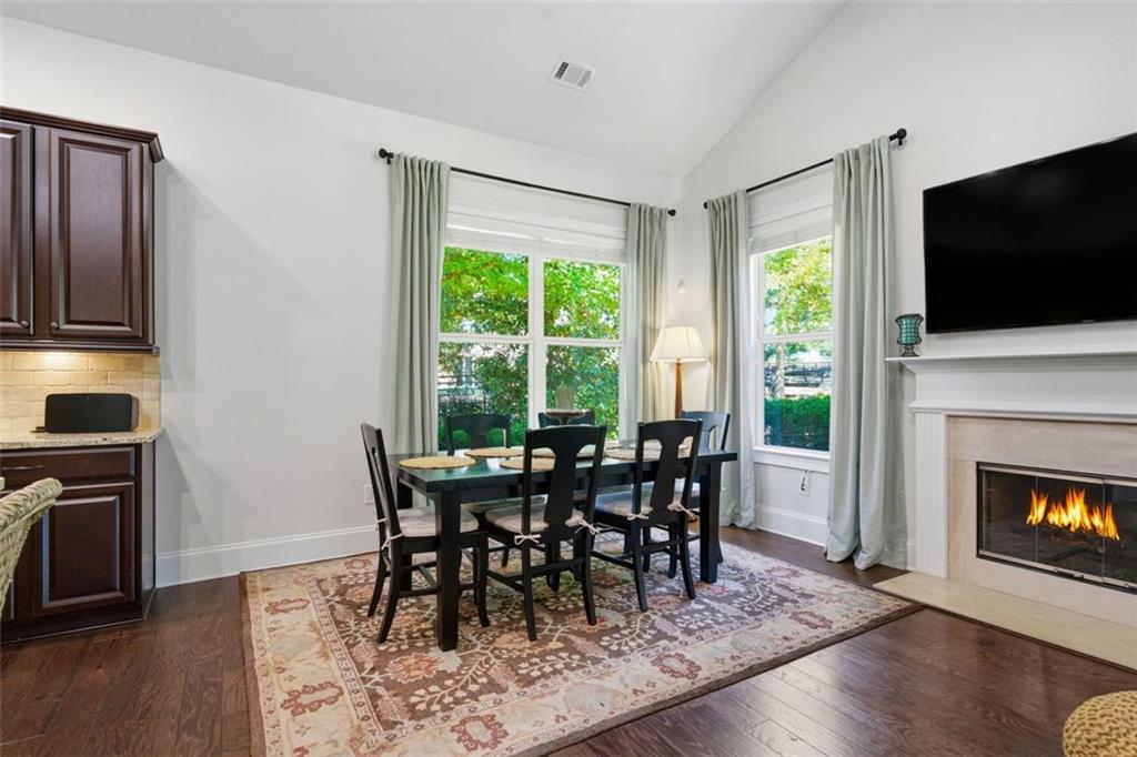 12115 Spence Way Alpharetta, GA 30004 - Photo 30 of 46 a view of a dining room with furniture window and wooden floor
