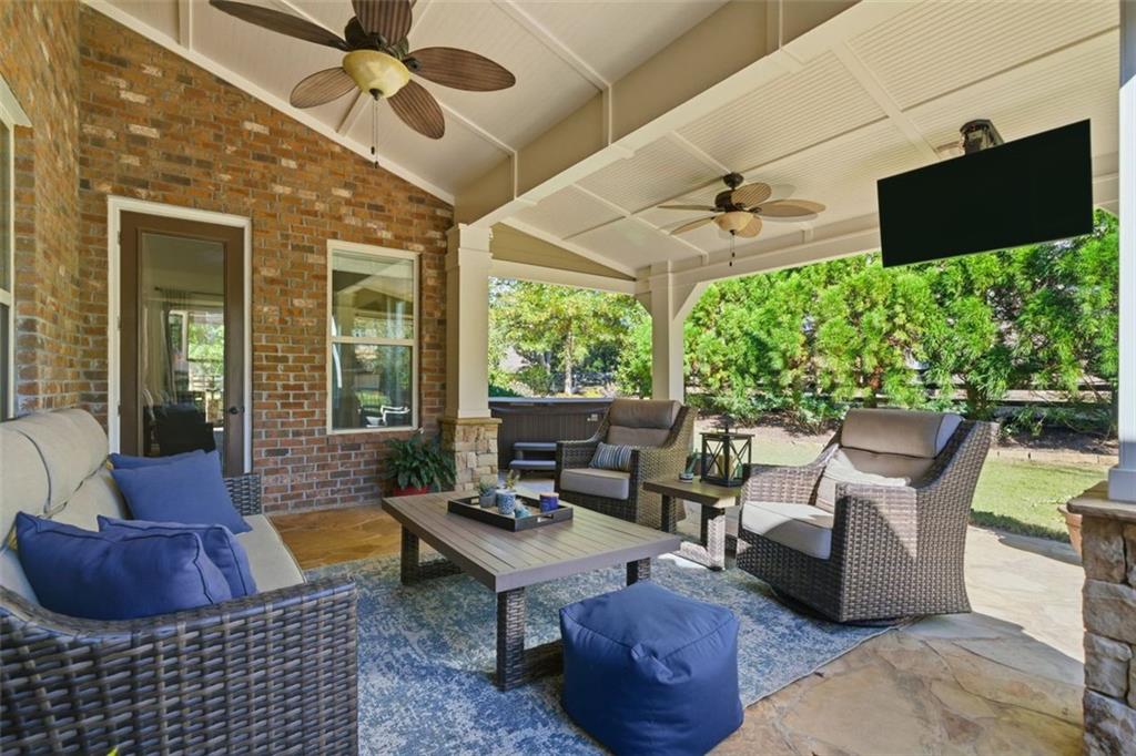 12115 Spence Way Alpharetta, GA 30004 - Photo 3 of 46 a living room with furniture and a flat screen tv