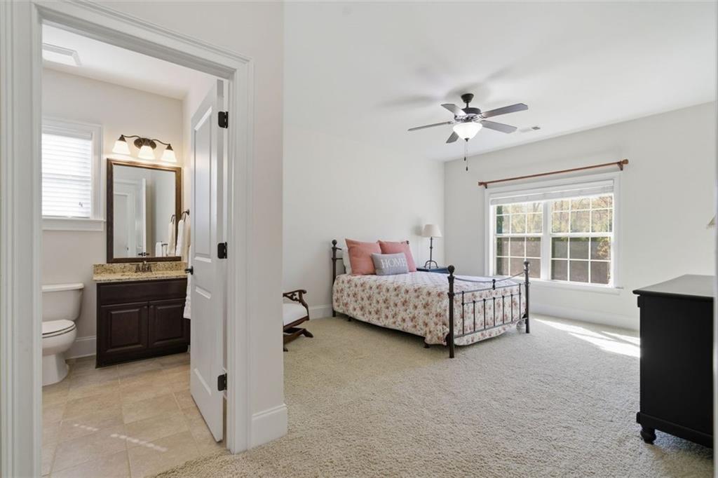 12115 Spence Way Alpharetta, GA 30004 - Photo 32 of 46 a living room with furniture and a flat screen tv