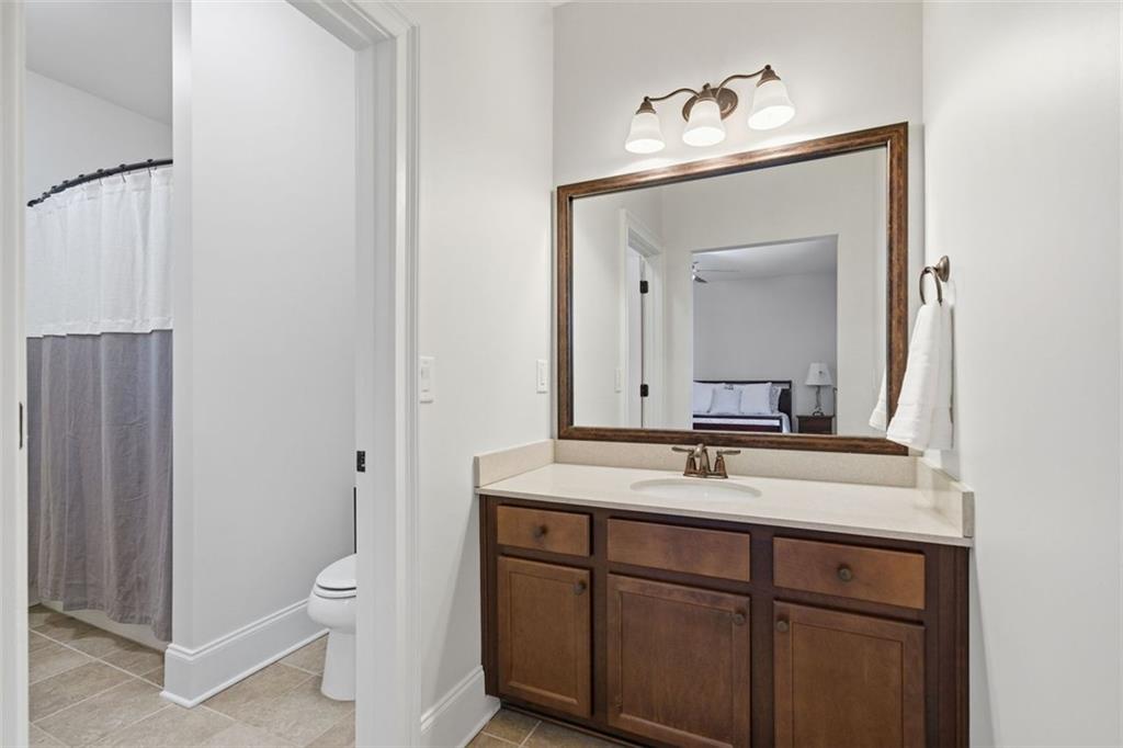 12115 Spence Way Alpharetta, GA 30004 - Photo 35 of 46 a bathroom with a sink vanity granite and a mirror