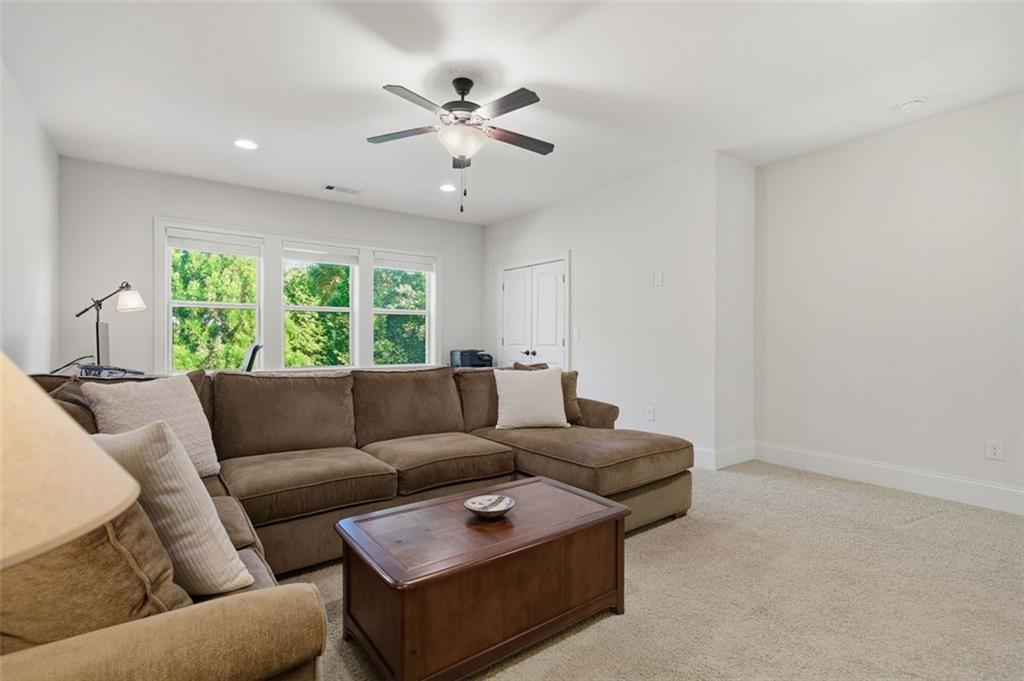 12115 Spence Way Alpharetta, GA 30004 - Photo 37 of 46 a living room with furniture and a large window