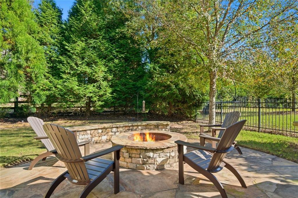 12115 Spence Way Alpharetta, GA 30004 - Photo 39 of 46 a view of a swimming pool with chair and table