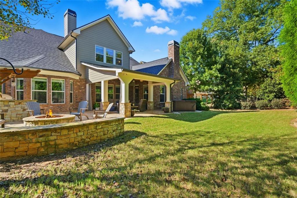 12115 Spence Way Alpharetta, GA 30004 - Photo 40 of 46 a view of a house with swimming pool and a large garden