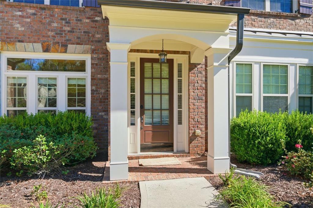 12115 Spence Way Alpharetta, GA 30004 - Photo 7 of 46 a front view of a building with a garden