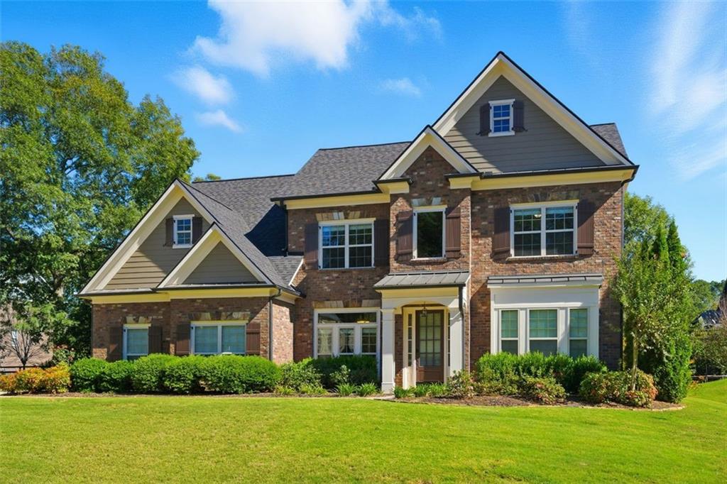 12115 Spence Way Alpharetta, GA 30004 - Photo 8 of 46 a front view of a house with a yard