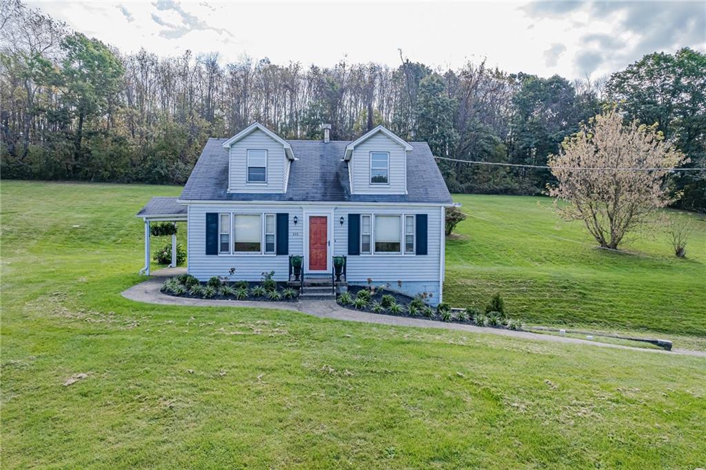 222 Maple Road Washington, PA 15301 - Photo 1 of 24 a front view of a house with a garden
