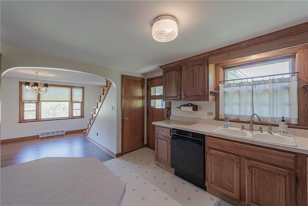 222 Maple Road Washington, PA 15301 - Photo 14 of 24 a kitchen with stainless steel appliances granite countertop a sink stove and cabinets