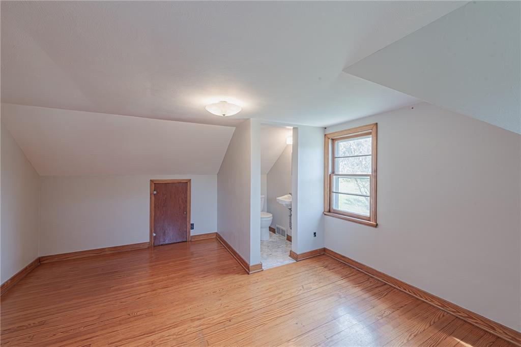222 Maple Road Washington, PA 15301 - Photo 22 of 24 an empty room with wooden floor and windows