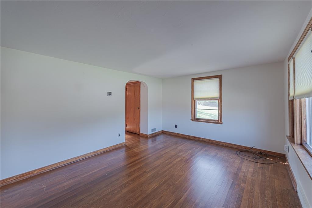 222 Maple Road Washington, PA 15301 - Photo 8 of 24 an empty room with wooden floor and windows