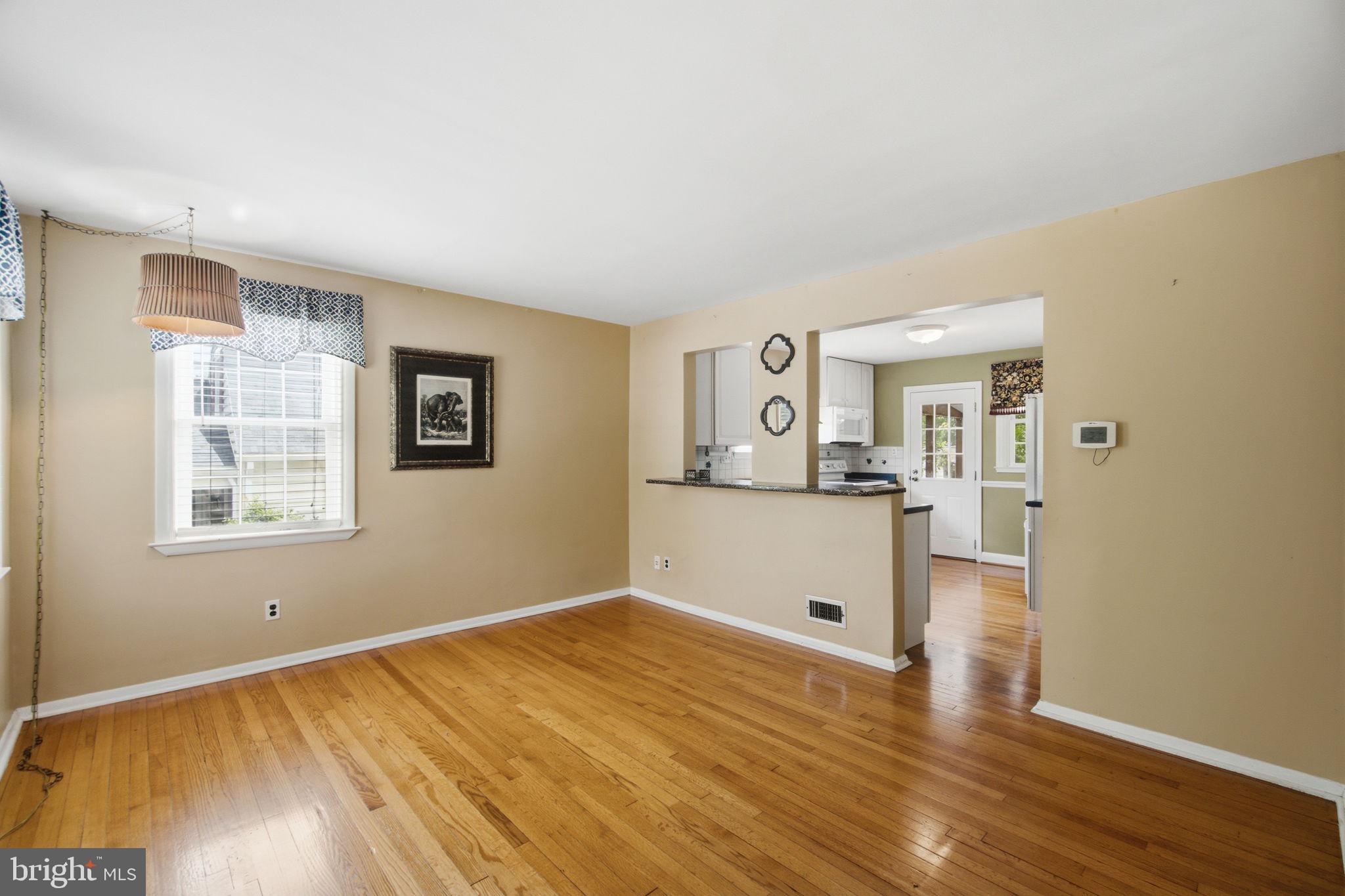 107 Oakway Road Lutherville-Timonium, MD 21093 - Photo 6 of 52 Living room with a pass through to the kitchen