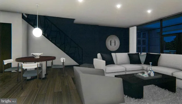 a living room with furniture and a clock