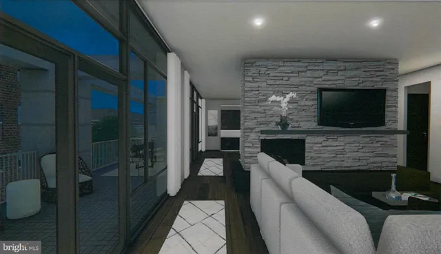 a living room with furniture wooden floor and a flat screen tv