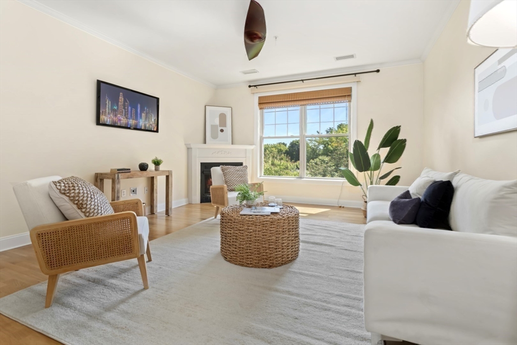 248 Albion Street, Unit 233 Wakefield, MA 01880 - Photo 13 of 39 a living room with furniture and a large window