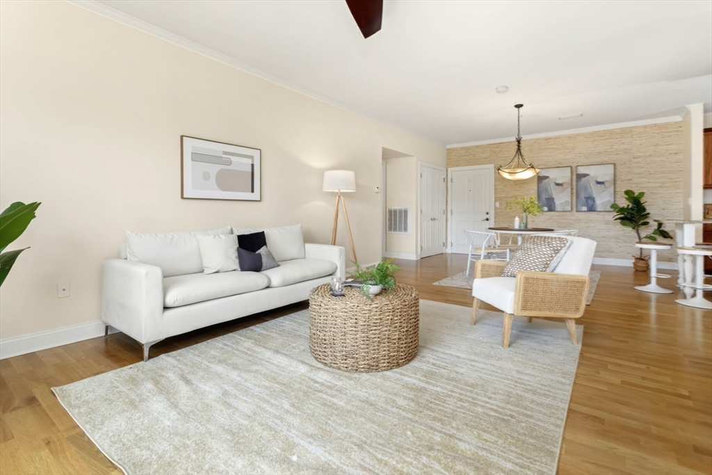 248 Albion Street, Unit 233 Wakefield, MA 01880 - Photo 16 of 39 a living room with furniture and a wooden floor