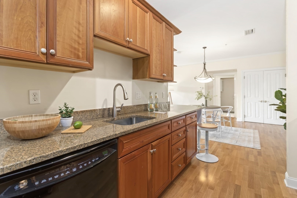 248 Albion Street, Unit 233 Wakefield, MA 01880 - Photo 18 of 39 a kitchen with sink a stove and cabinets