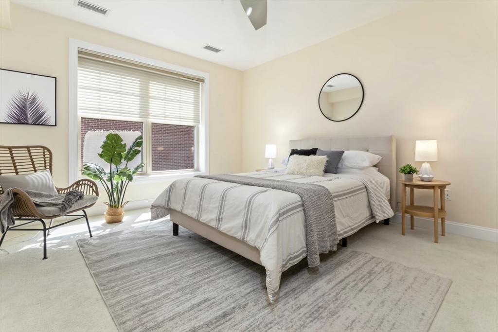 248 Albion Street, Unit 233 Wakefield, MA 01880 - Photo 22 of 39 a bedroom with bed and a window