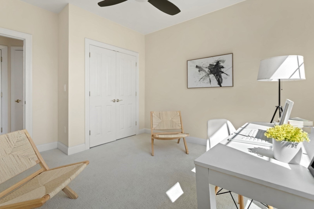 248 Albion Street, Unit 233 Wakefield, MA 01880 - Photo 32 of 39 a living room with furniture and a table