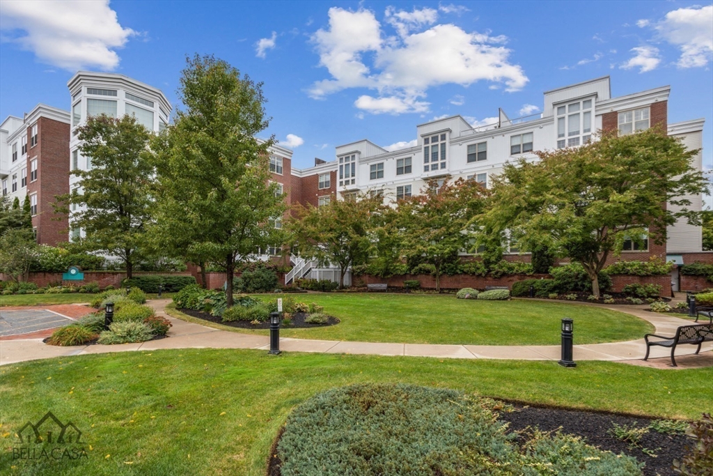 248 Albion Street, Unit 233 Wakefield, MA 01880 - Photo 4 of 39 a view of a building and a yard
