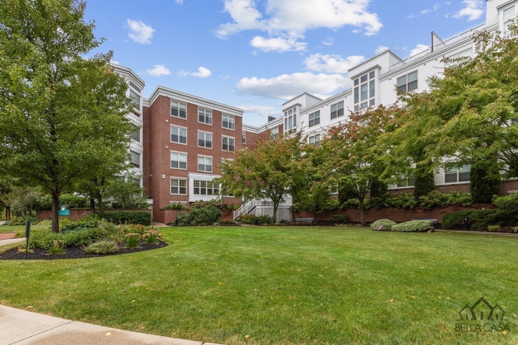 248 Albion Street, Unit 233 Wakefield, MA 01880 - Photo 5 of 39 a view of a building with a yard