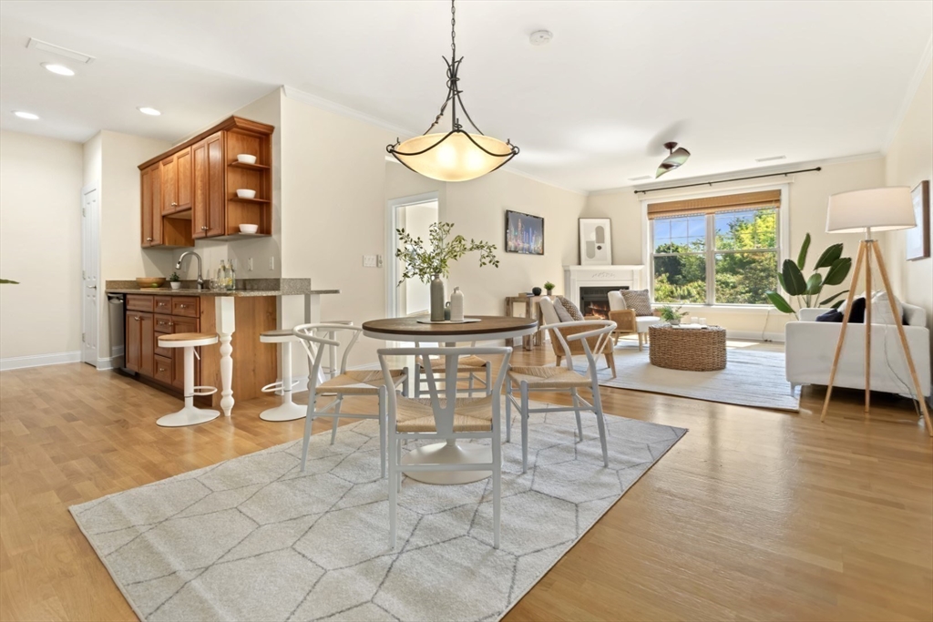 248 Albion Street, Unit 233 Wakefield, MA 01880 - Photo 7 of 39 a view of a dining room with furniture window and outside view