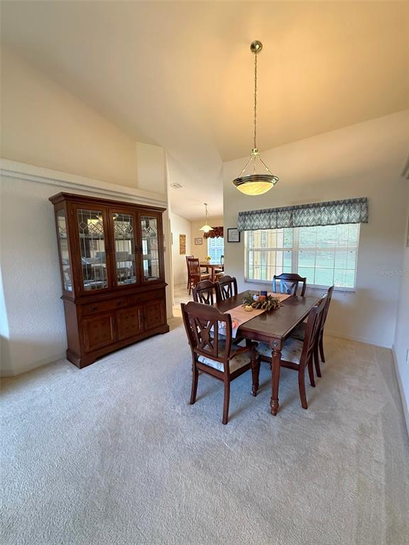 4980 Southeast 47th Terrace Road Ocala, FL 34480 - Photo 11 of 54 a view of a dining room with furniture window and outside view