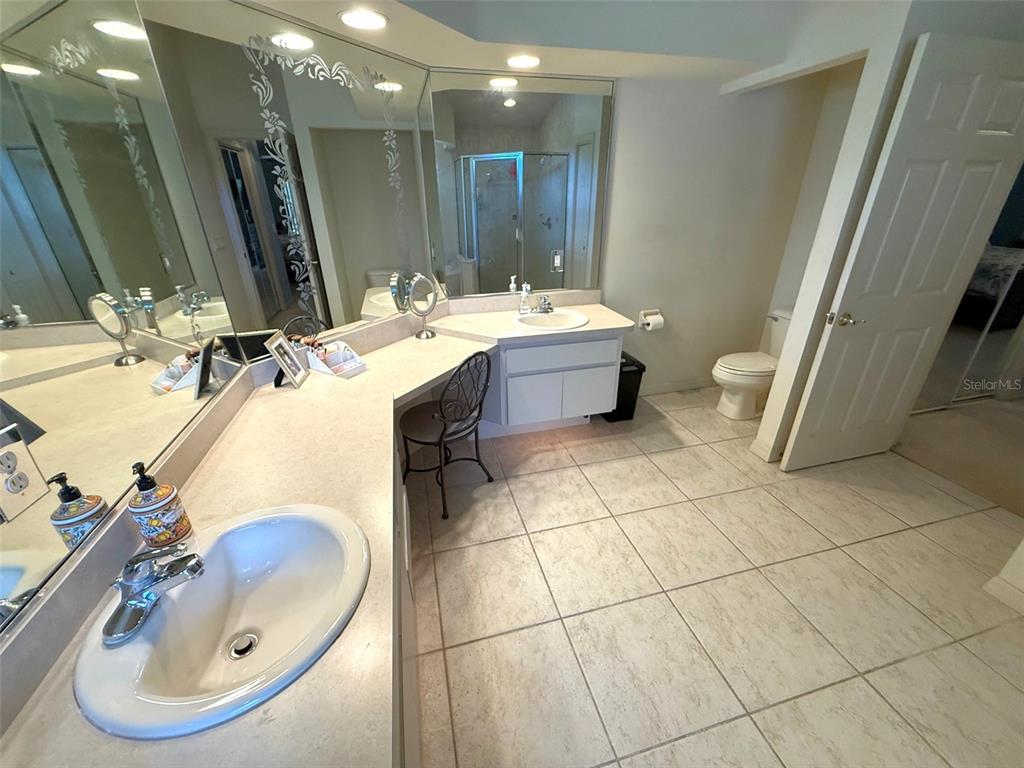 4980 Southeast 47th Terrace Road Ocala, FL 34480 - Photo 27 of 54 a bathroom with a sink toilet and a mirror