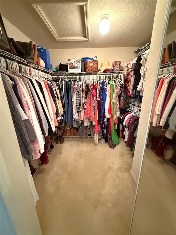4980 Southeast 47th Terrace Road Ocala, FL 34480 - Photo 28 of 54 a view of walk in closet with clothes
