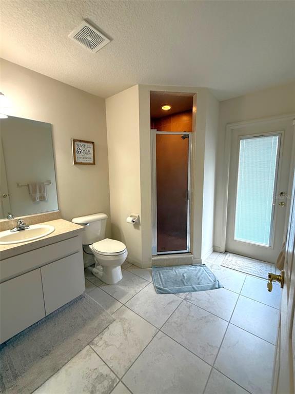 4980 Southeast 47th Terrace Road Ocala, FL 34480 - Photo 29 of 54 a bathroom with a toilet sink and mirror
