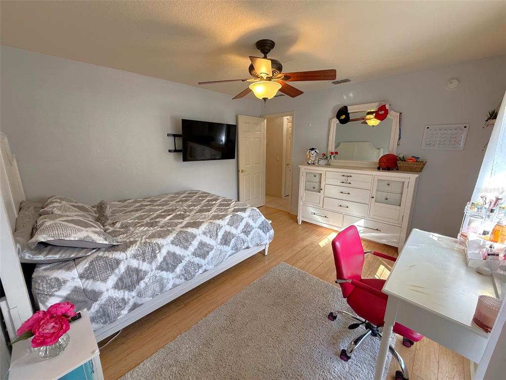 4980 Southeast 47th Terrace Road Ocala, FL 34480 - Photo 34 of 54 a bedroom with a bed and window